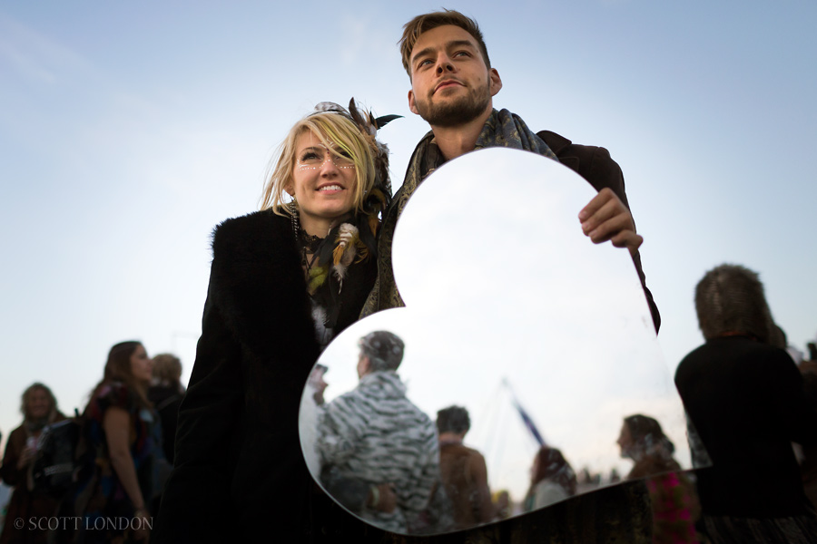 Burning Man is nothing if not a giant love fest. One couple held up a heart-shaped mirror to all the attendees dancing at Robot Heart. (Photo by Scott London)