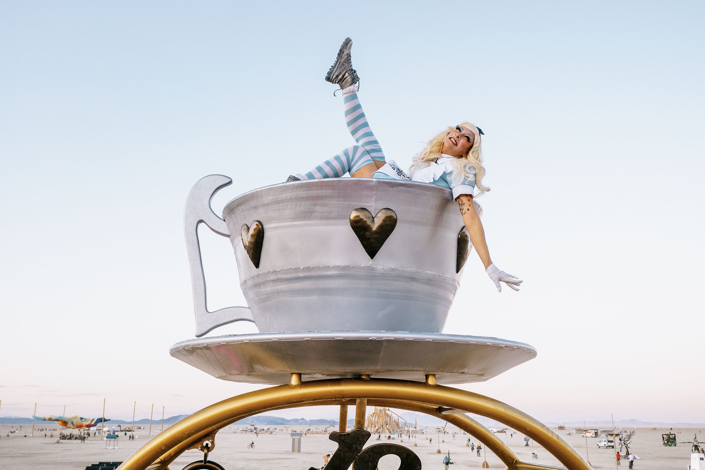 Ali Luminescent atop "The End of Time," an art installation by artists Andrea Greenlees and Andy Tibbetts at Burning Man 2024. (Photo by Scott London)