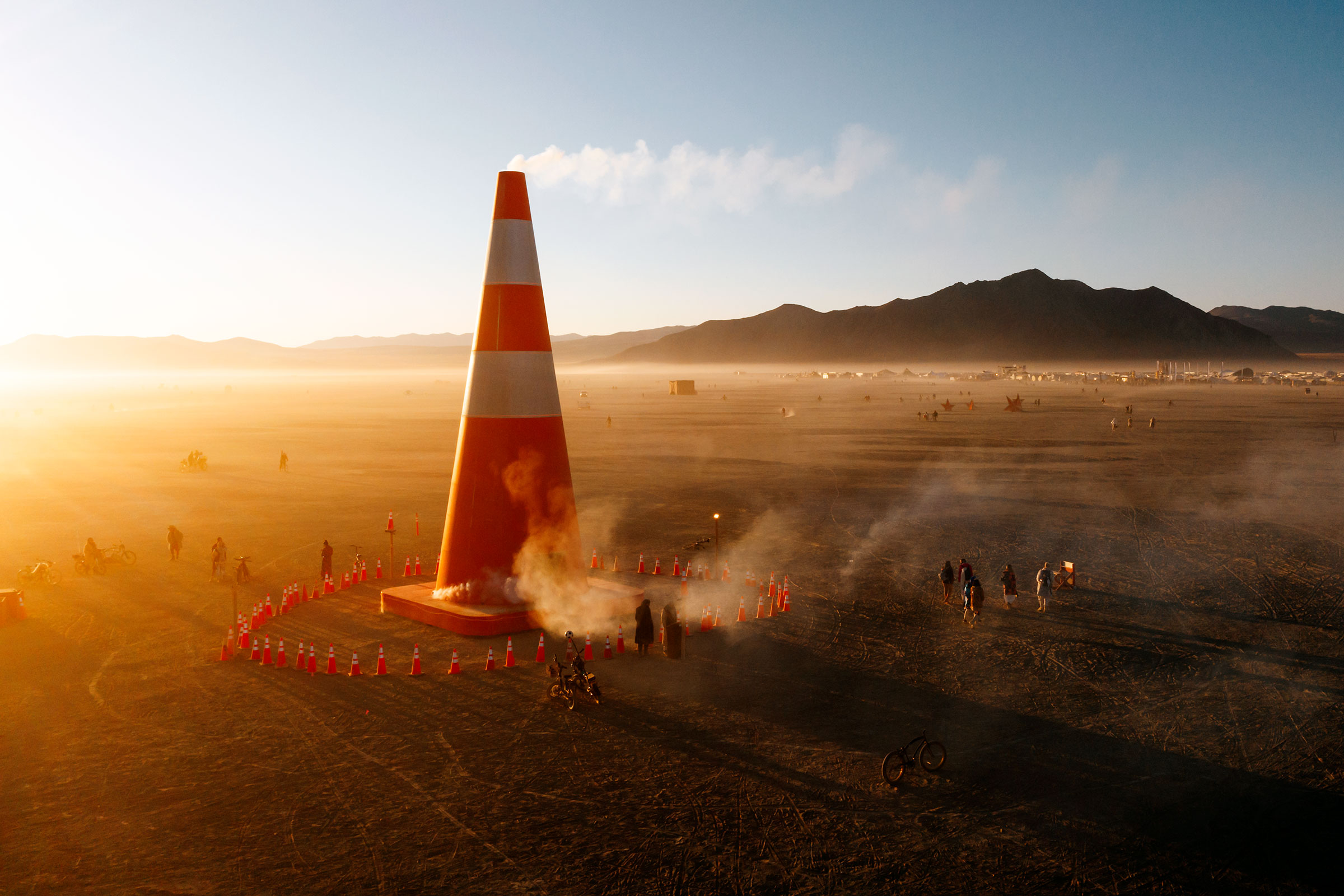 Coney McConeface, a 60-foot traffic cone, purportedly built to protect the citizens of Black Rock City from a dangerous geothermal cavity beneath the desert floor. The installation was created by New Zealand artist Chris "Kiwi" Hankins and the merry pranksters of the ConeCophony Collective. (Photo by Scott London)