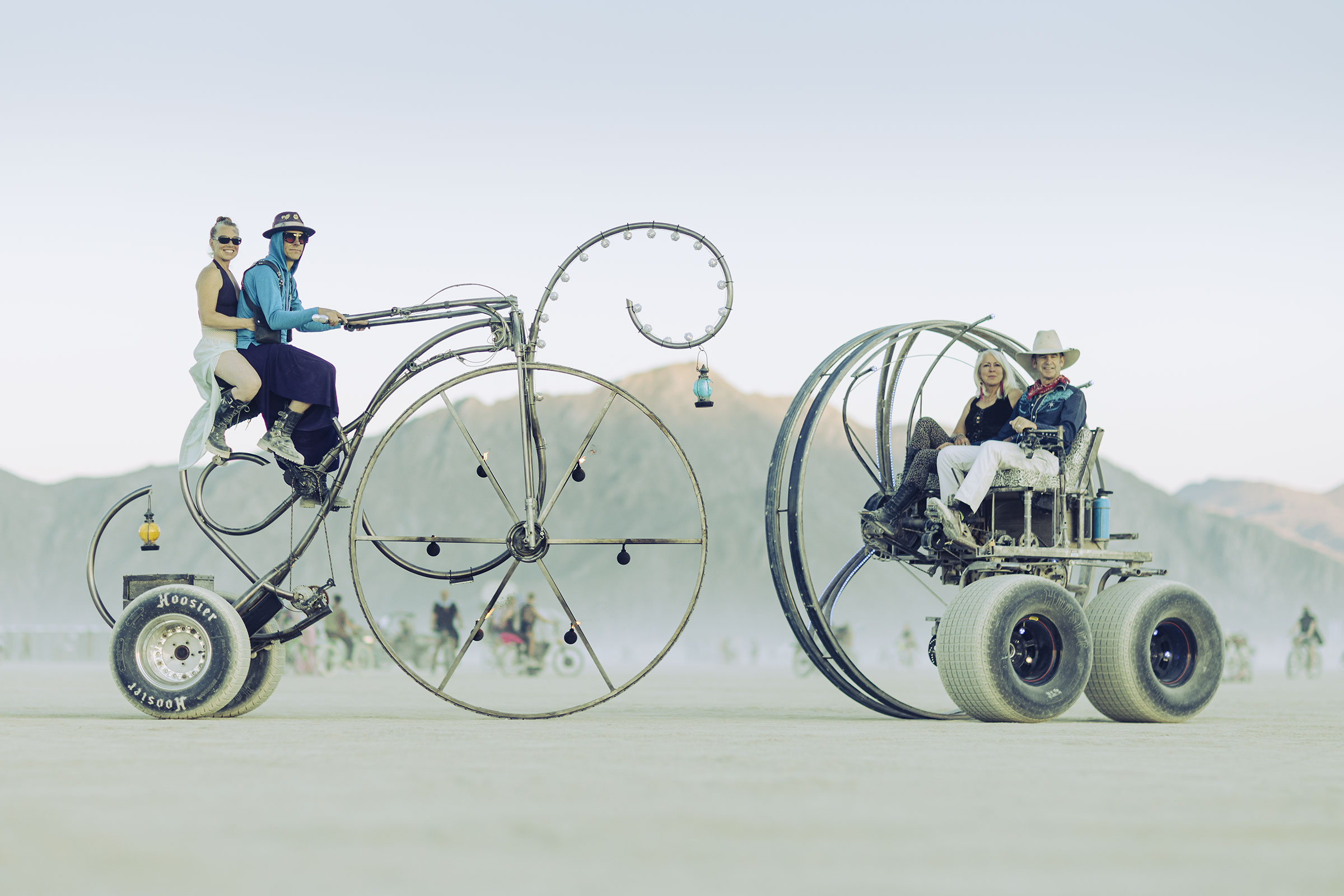 Two iconic pedal-powered art installations at Burning Man 2024: The Dreamcycle by Randall Gates (left) and Third Wheel by Fred Besch (right)